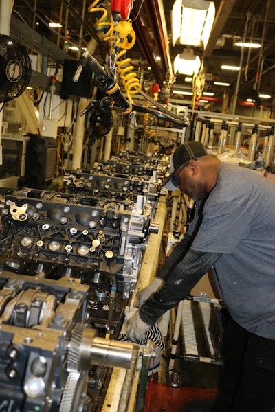 An employee at the DMAX, LTD engine plant assembles Duramax diesel engines in Moraine, Ohio.