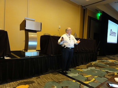 Bob Hausler, vice president of technology and marketing for Dossier Systems, speaks at the opening day of the user conference on April 19