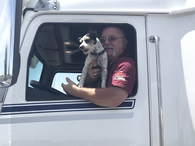John Osborn and Sassi drive away in their new Western Star.