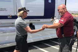 Western Star president Kelley Platt presents OOIDA rep John Osborn with the keys to his new truck.