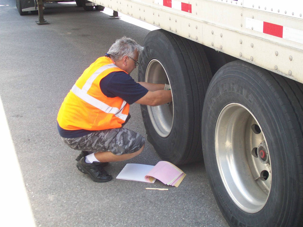 Transpro driver Csaba Juhasz conducts a wheel check during a pre-trip inspection competition at a company safety meeting. Juhasz and other Transpro drivers routinely receive hands-on training coupled with CarriersEdge on-line training to hone their vehicle inspection skills. The friendly competition encourages drivers to apply what they learn to be the best in the company. The competition and training go a long way in improving the company’s safety scores. Company managers say the competition and training go a long way in improving Transpro’s safety scores.