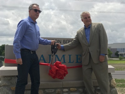 DTNA Aftermarket executives Stefan Kürschner and Jay Johnson open the company’s newest parts distribution center in Whitestown, Ind.