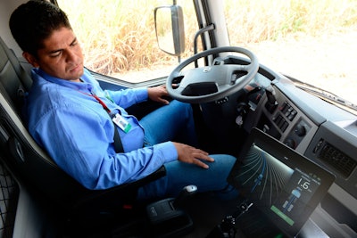 Man Sitting in Cab of Truck