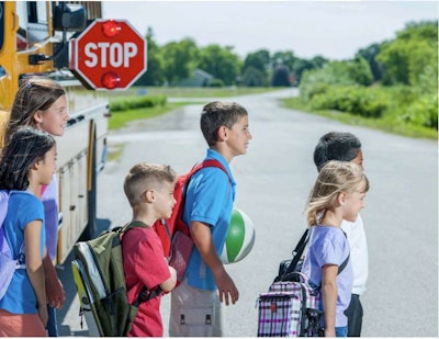 Children Getting off a School Bus