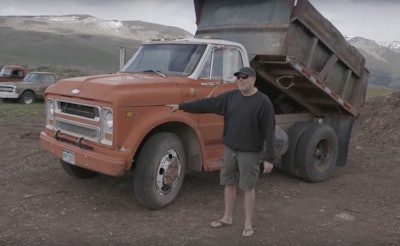 Roadkill host David Freiburger stands nexts to a 1969 Chevy C50 dump truck.