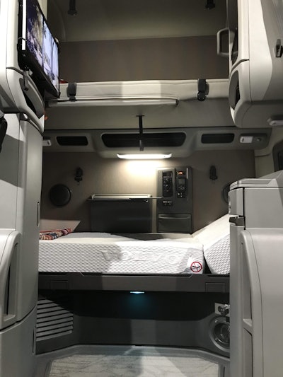 A cabin control cluster on the rear wall, ambient LED lighting and an optional reclining bunk add to driver comfort during rest periods.