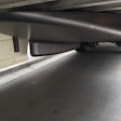 A full-width reinforced carbon-fiber bogie treatment acts like a boat’s hull under the trailer, separating the airflow coming into the trailer axles.