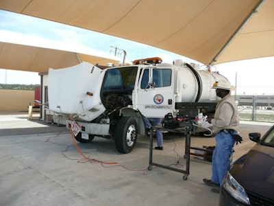 Todd Fowler, president of Commercial Hydrogen, works to establish baseline of fuel useage prior to installation of Commercial Hydrogen device. The Texas-based company reports getting increased fuel mileage and better emissions with its bolt-on injection system.