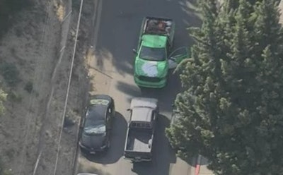 A green Right Price plumbing truck blocks the path of a driver who had been evading police in Los Angeles on Thursday.