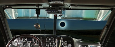At least portions of 14 states will see a total eclipse Monday, Aug. 21. Several state DOTs have placed restrictions on oversize/overweight trucks in the days around the event. (Illustration by Kenneth Stubbs)