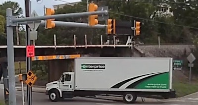 Trust us…it’s not going to end well for this truck as it attempts to squeeze under this low bridge in Durham, N.C.