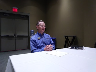 Tom McLeod addresses industry press at the annual conference.