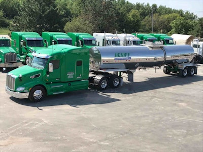 Heniff Transportation Systems semi truck parked among other trucks