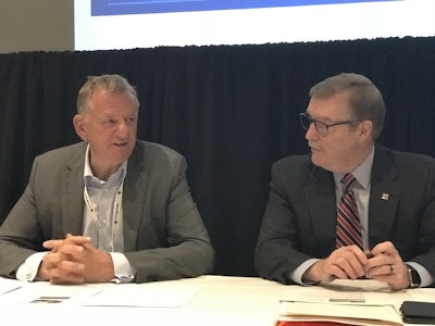 Volkswagen Truck & Bus CEO Andreas Renschler (left) and Troy Clarke, Navistar’s chairman, president and CEO (right), discuss plans for future product integration.