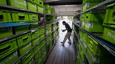 Employee putting things in containers