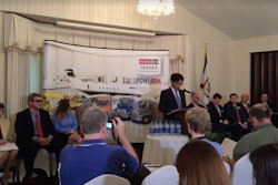 Hino Motors Manufacturing U.S.A. President Takashi Ono announces plans for the company’s new truck plant today in West Virginia.