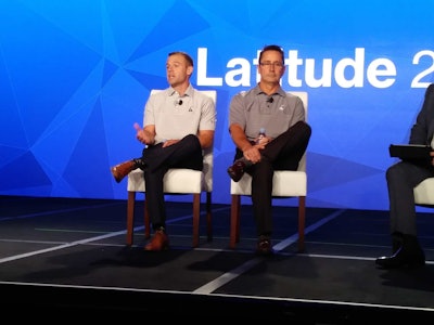 Craig Stevenson, left, and Thomas Smuda discuss Hershey’s implementation of Telogis Route on Oct. 24 at the Latitude conference.