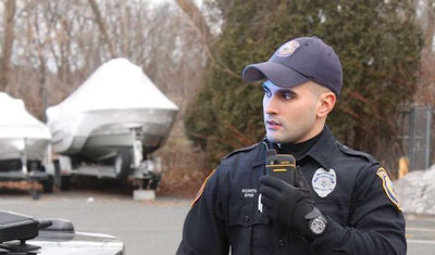 Police officer using Push to Talk feature on a phone