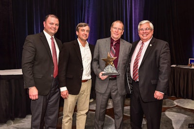 Walmart Transportation driver Gary Plant was named the National Driver of the Year. Shown, from left, are: Jason Wing, Walmart director of fleet safety; Mike Noble, Walmart senior director of fleet safety; Plant; and Dennis Shinault, director of loss prevention and safety services for Baldwin & Lyons Insurance.