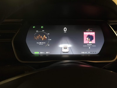 The instrument cluster is clean and organized but has no dials or gauges.