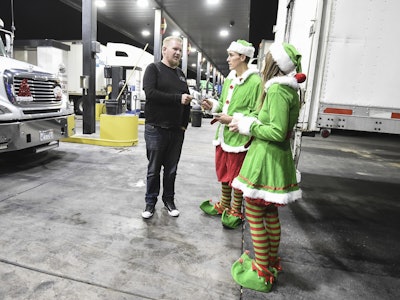 Elves spread holiday cheer as they invite a truck driver to a private Brothers Osborne concert and dinner hosted by Verizon Telematics on Thursday, Dec. 14. Photo by Dan Steinberg/Invision for Verizon Telematics