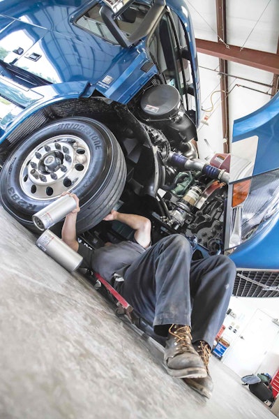 Mechanic Under Semi-Truck