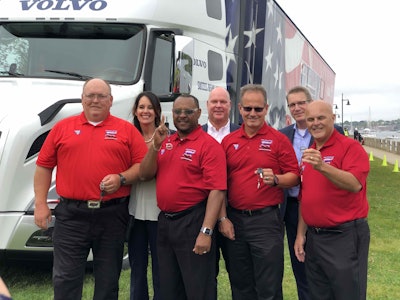 America’s Road Team captains in front of a Volvo semi truck