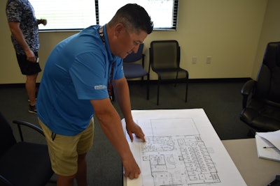 Brian Singleton, Prime’s terminal manager, reviews blueprints for the new facility.