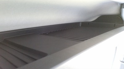 Additional storage space is located above the cab