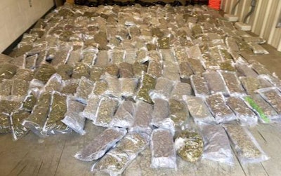 Two Florida-based truckers were arrested recently in Indiana for hauling 260 pounds of marijuana concealed in a load of fresh lettuce. (Indiana State Police photo)