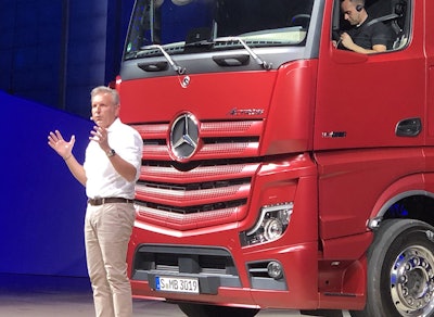 Stefan Buchner, head of Mercedes-Benz Trucks, touts the features of the new Actros at a special media event in Hannover, Germany.