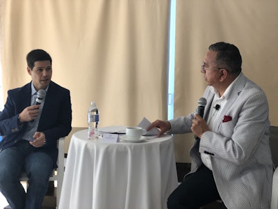 Fernando Paez (left), owner and CEO of Olympic Transport, discusses the driver shortage with Flavio Rivera, president and CEO of Daimler Trucks Mexico.