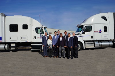 From left, Nick Miller, Load One’s vice president of operations; Becky Kennedy, Load One’s vice president of administration; Paito Anderson, App Nouveau Canada’s chief technology officer; Brian Whitley, Load One’s president; Gabe Prestia, ANC’s chief information officer; John Elliott, Load One’s chief executive officer; Ed De Leon, ANC’s CEO; and Mike Johnson, Load One’s vice president of Fleet. Photo by Mary Rosecrans.