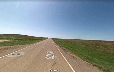 Looking south from the bridge up Highway 37. Ranch land is located on either side.