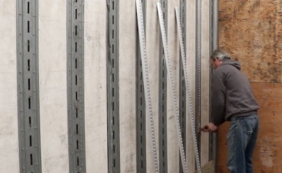 Man using decking system in trailer