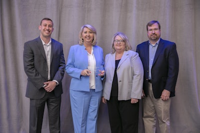 Audrey Ponsell, chief operating officer of Pope Trucking, holds the award for Carrier of the Year in the 51-100 truck category.