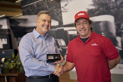 Brent Nussbaum (left), chief executive, presents the ring to drivers in a graduation ceremony in the middle of the operations floor.