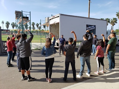 In addition to a trucking-specific curriculum around topics like pre- and post-trip inspections, steer tire blowouts and proper shifting techniques, students in Patterson High’s program take lessons on physical education specific to trucking, provided by Worklete. The company deploys interactive training conducted once a week, mirroring the program it offers to major fleets like Penske.