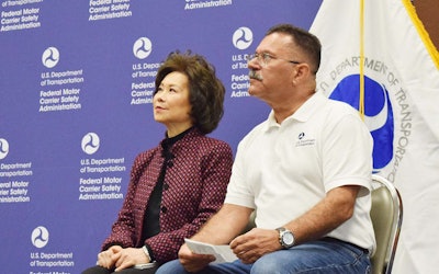 Transportation Secretary Elaine Chao, left, sits with FMCSA Administrator Ray Martinez during a presentation at the Mid-America Trucking Show in March.