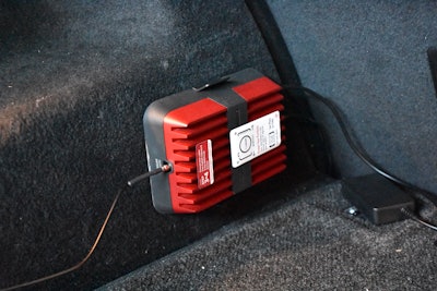 The Drive Reach signal booster has a power unit that clings to carpeted surfaces.