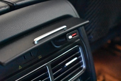 The power cord connects to a 12V outlet and includes a USB charger.