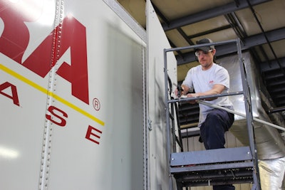 XTRA Lease mechanic Scott Kalicki replaces a door seal.