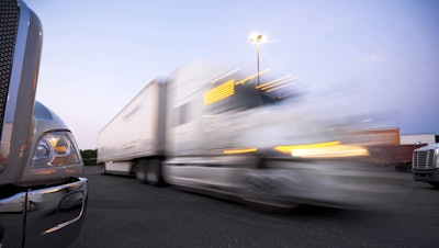 Semi trucks passing each other
