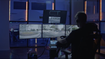 Employee monitoring watching multiple computer monitors