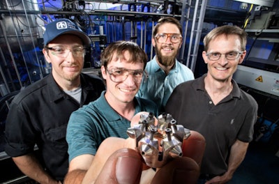 From left: Sandia Lab researchers Nathan Harry, Christopher Nilsen, Drummond Biles and Charles Mueller show a patented ducted fuel injection module. (Photo courtesy of Sandia National Laboratories.)
