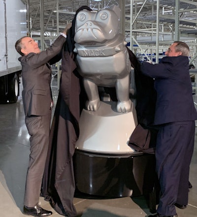 Virginia Gov. Ralph Northam and Mack president Martin Weissburg unveil the Mack bulldog that will feature prominently in the company’s new Salem production facility.