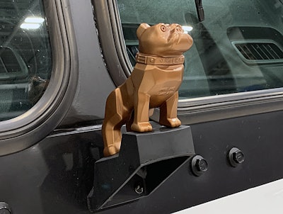 The truck’s copper-colored Bulldog hood ornament signifies it’s an electric vehicle.