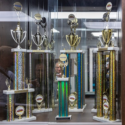 Trophies in Smith Transport’s maintenance building date back to the early 1980s when owner Barry Smith took his employees to the racetrack on the weekends for truck races and sled pulls.