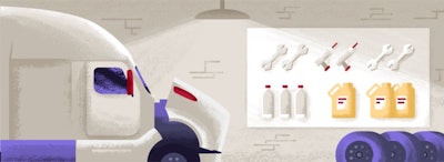 A truck getting a maintenance checkup