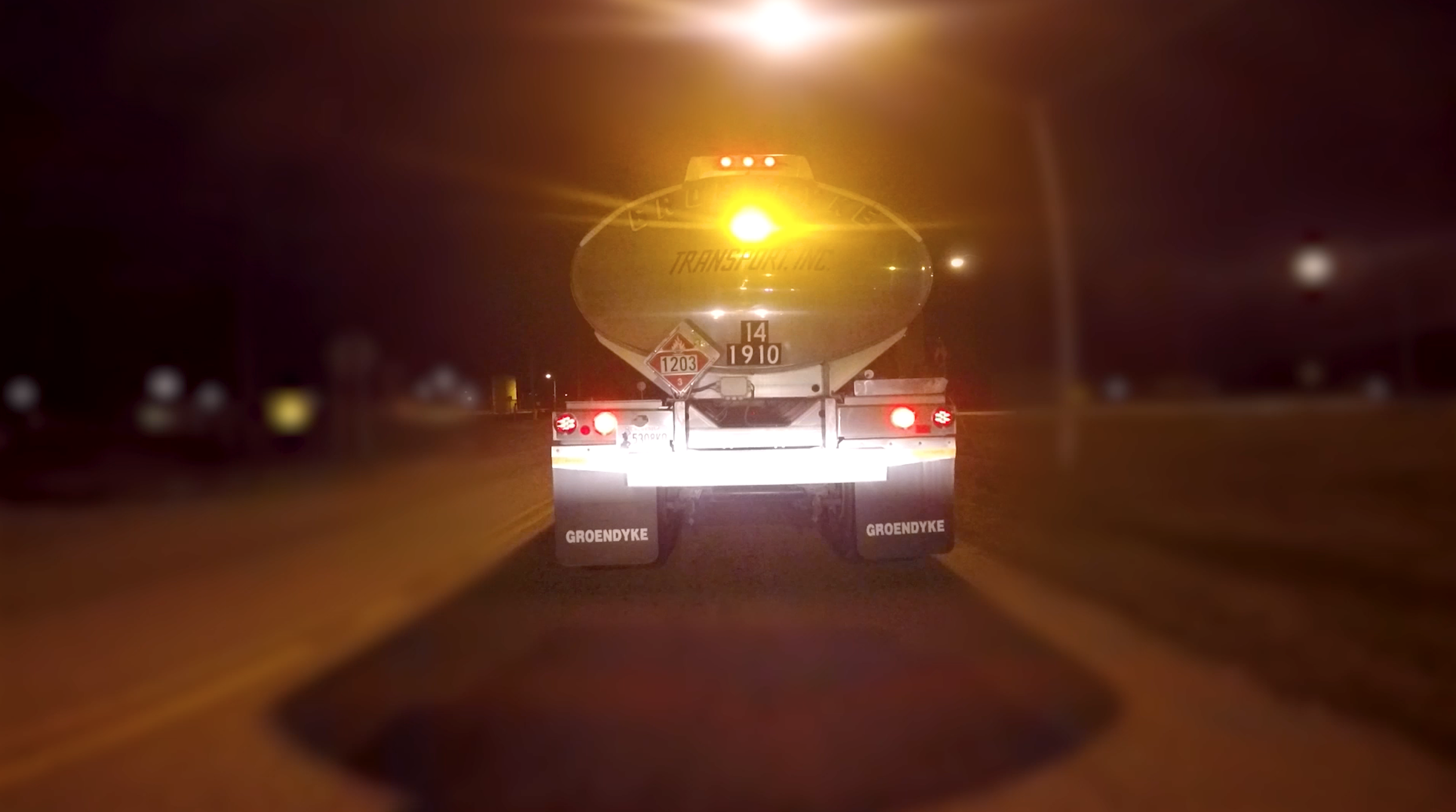 groendyke transport tanker featuring pulsating brake light at night